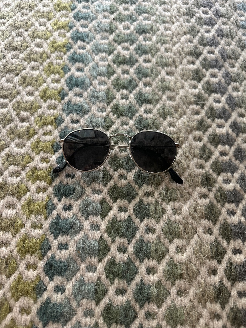 Silver rimmed sunglasses